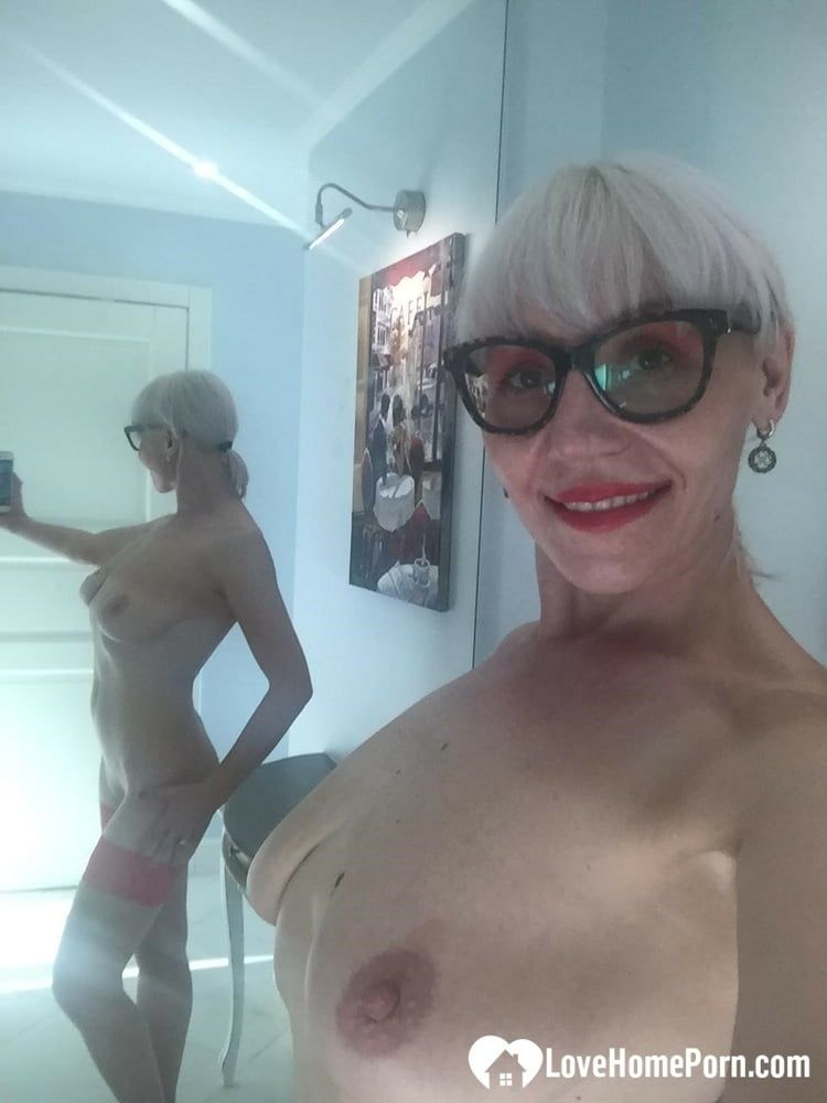 Blonde MILF with glasses teasing with nudes #18