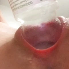 The neck of a Tropicana bottle swallowed