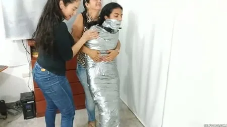 heavily duct tape mummified by crazy bondage women         