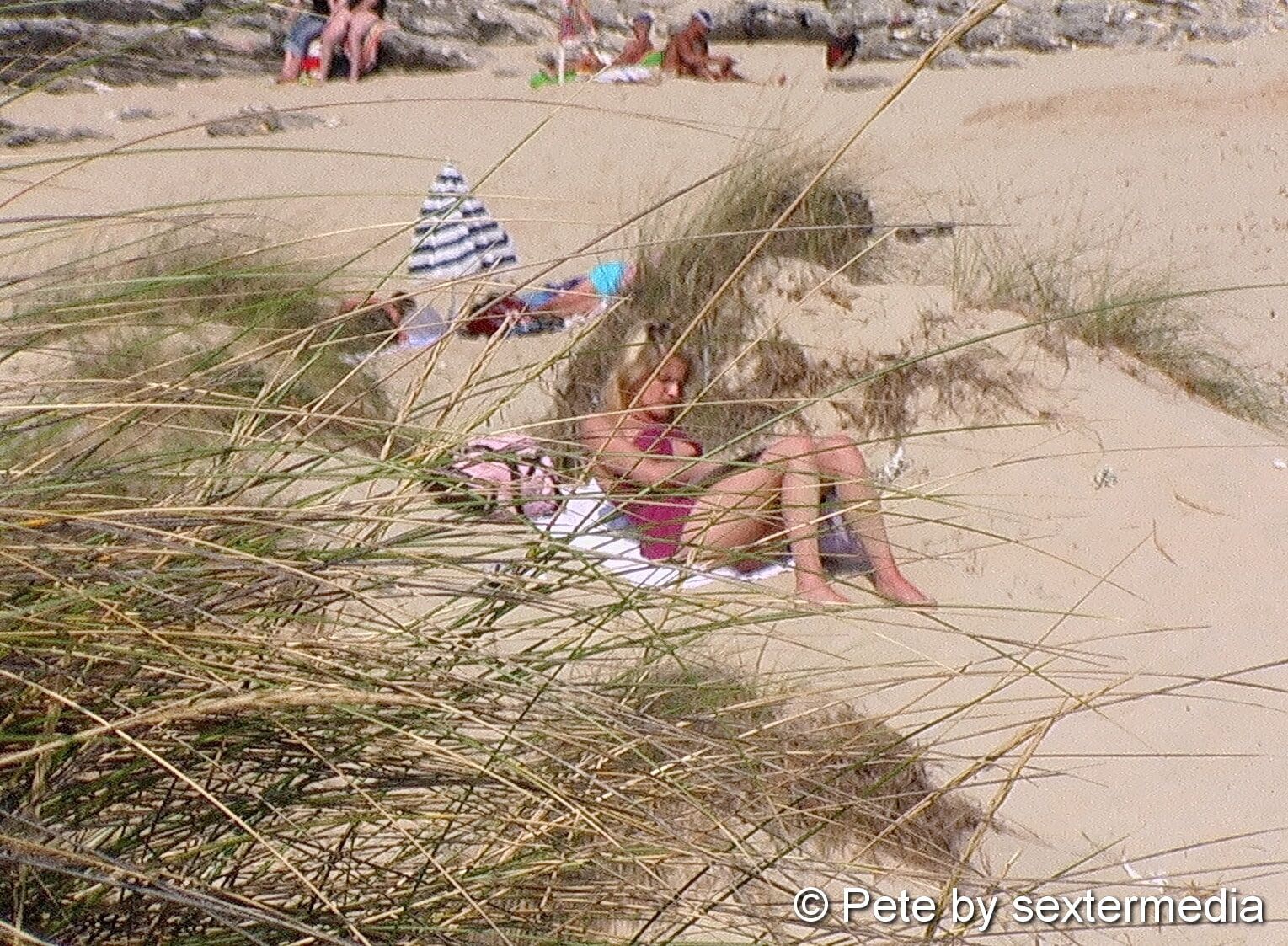 Milf feels unobserved on nudist beach #2