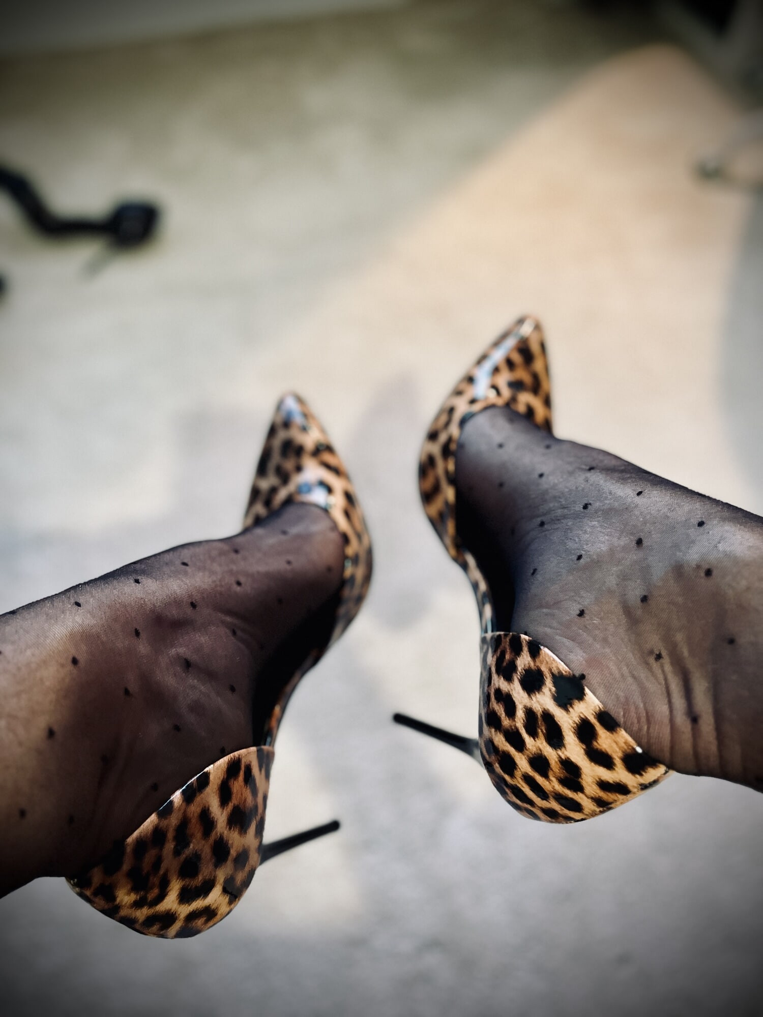 Dotted pantyhose in high heels