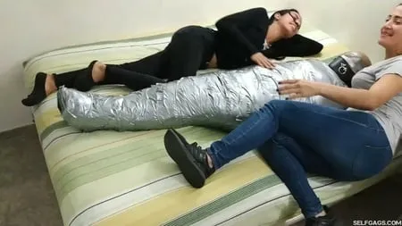 sexy girl trapped in ultra tight layered mummification         