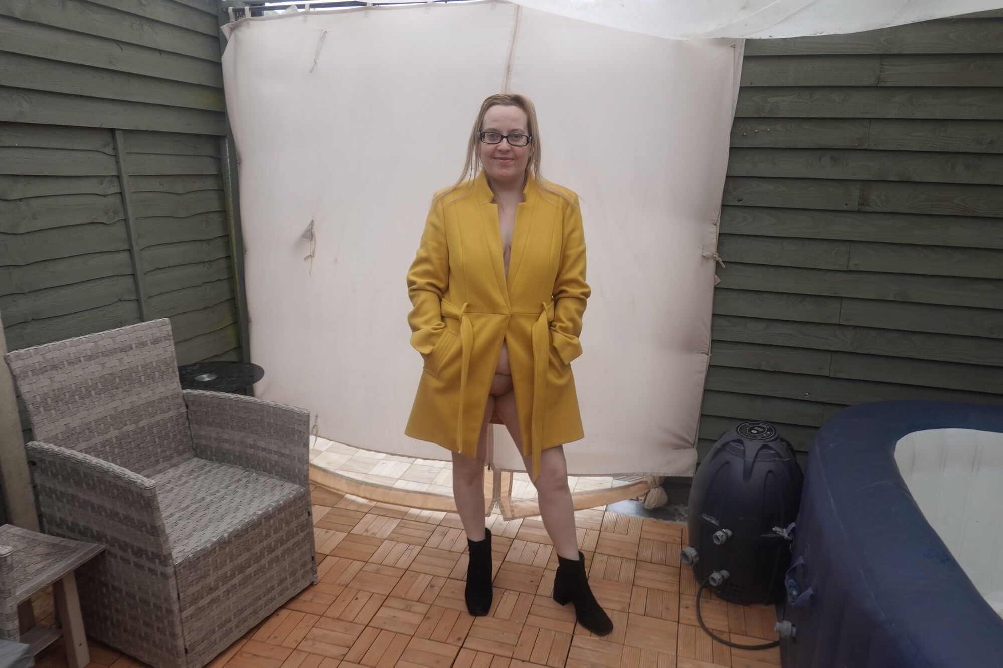 British Wife In coat out in the Yard in the cold