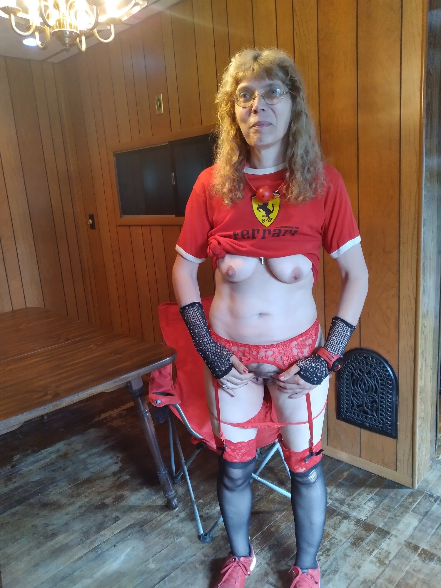 Red and black garters Ferrari outfit on breakfast table #7