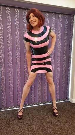 sissy lucy in latex and chastity cage         