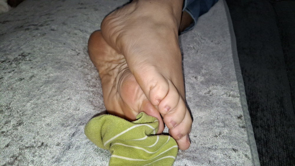 Playing with her socks and putting them back on #9