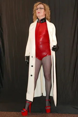 latex rubber mackintosh coat latex bodysuit and fishnets         