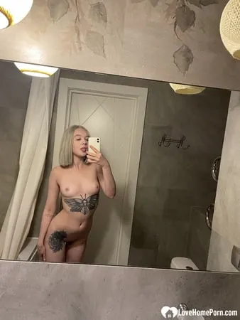 tattooed blonde showing off her sexy tattoos         