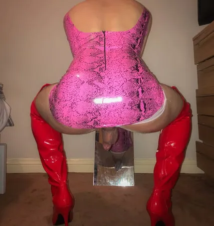 pink vinyl pvc snakeskin dress with red latex boots         