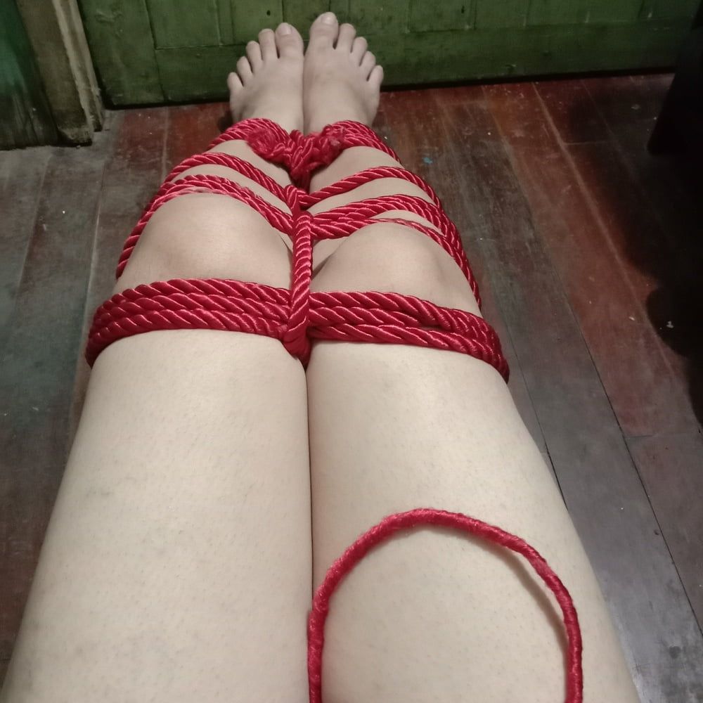 His white legs were tied with a red rope. #19