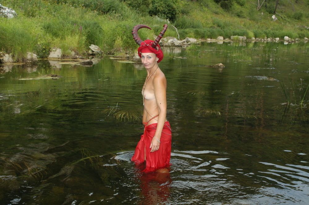 With Horns In Red Dress In Shallow River #12