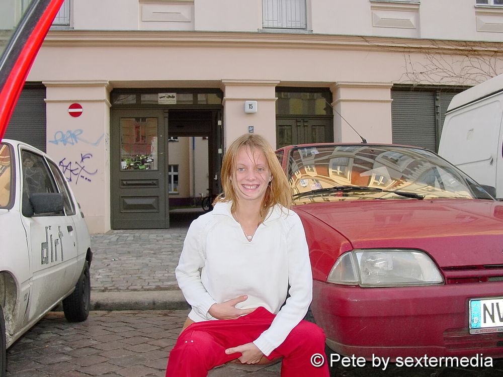 Red-haired teen Petty is limber at the photo shoot