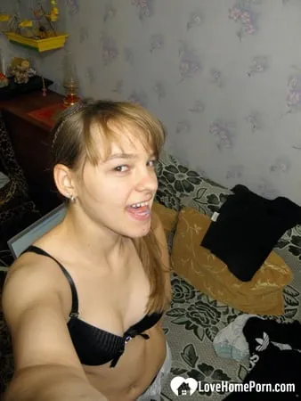 petite teen slowly strips off her clothes         