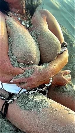 hotwife with giant big natural tits covered with lake sand         