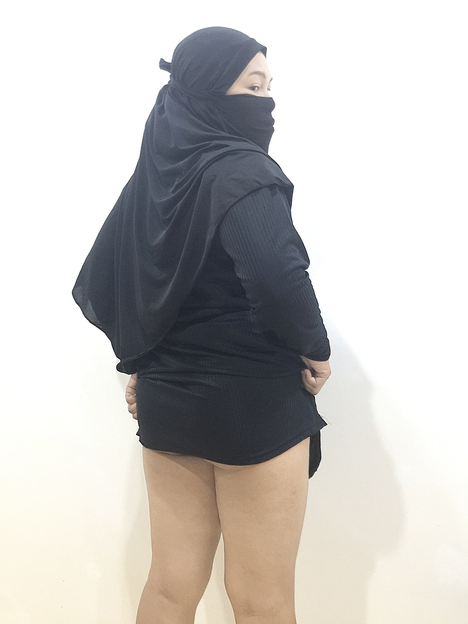 Her hijab covers, but her eyes tell so much more