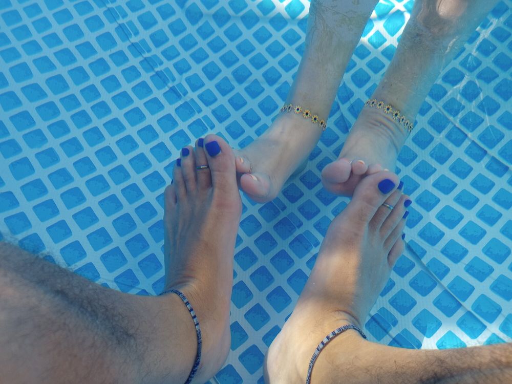 Showing off our pedicures in the pool #19