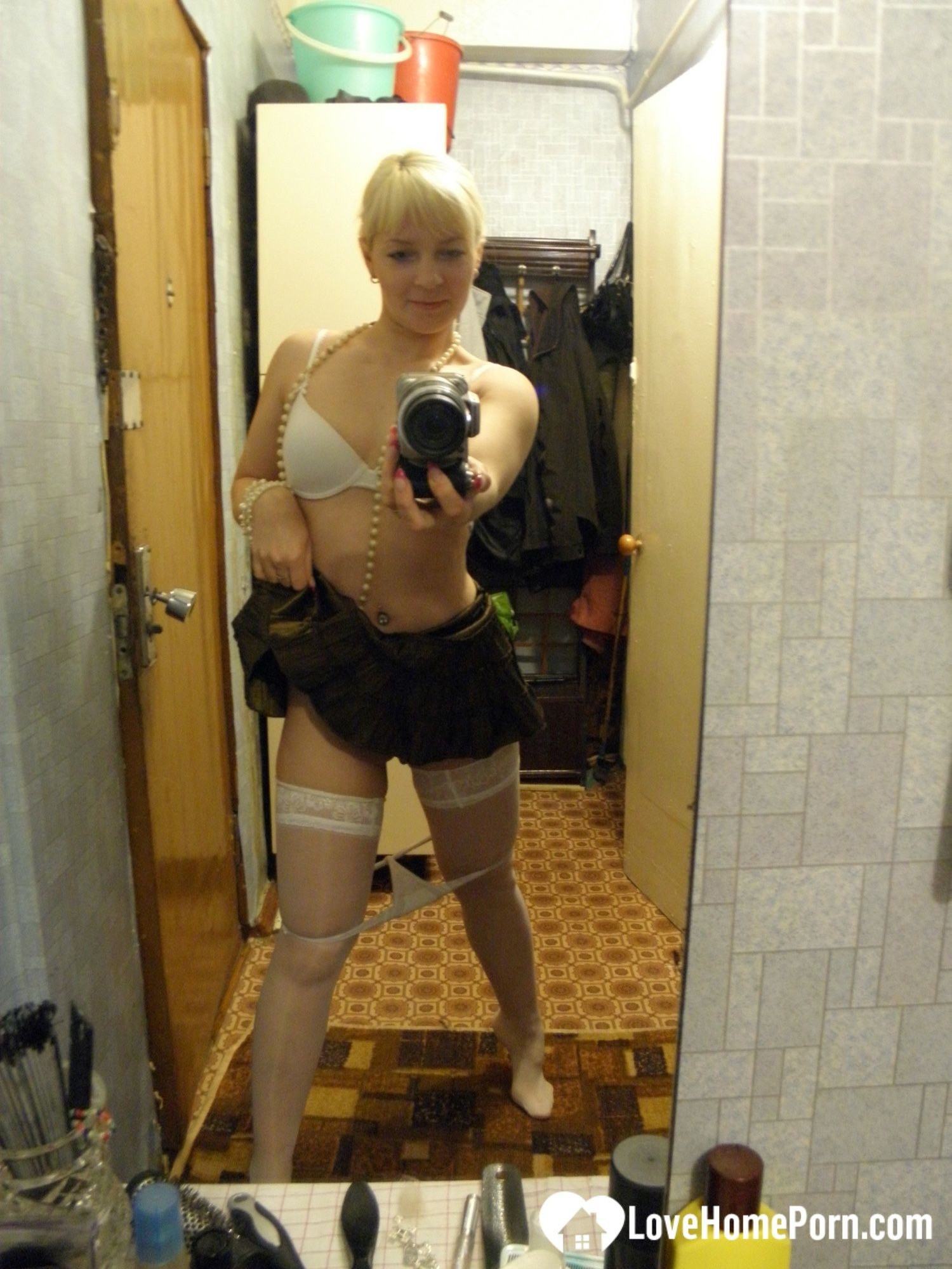 Aroused blonde in stockings taking naughty selfies #14
