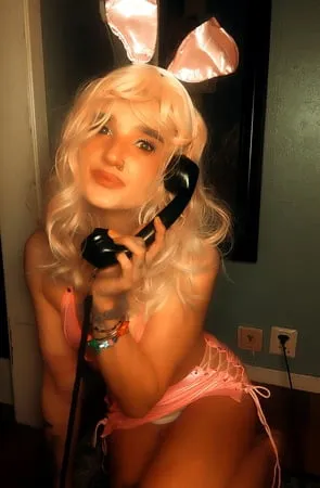 pink bunny talking on the phone while showing off pussy         