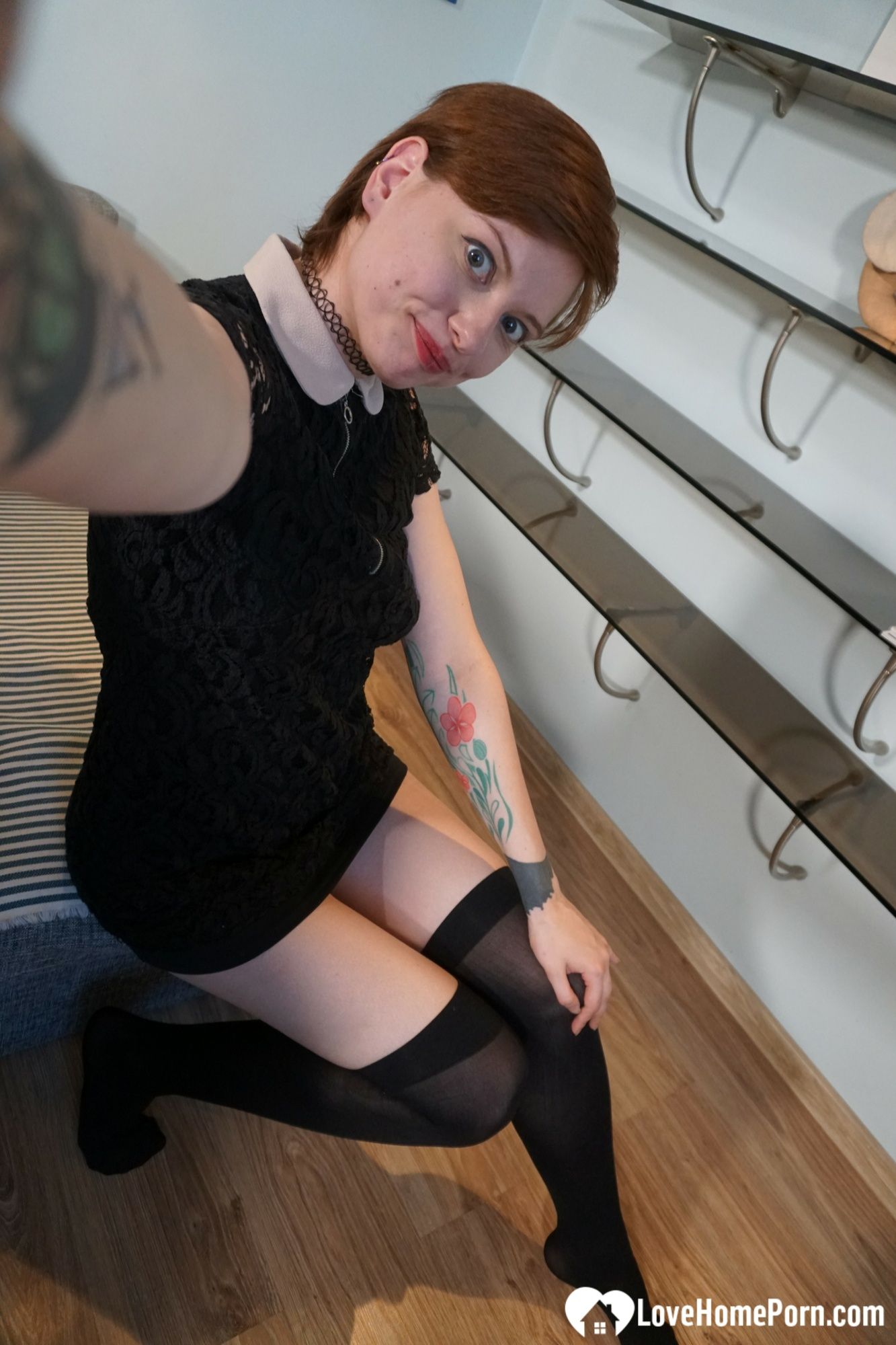 Sweet redhead gets naked in the office #5
