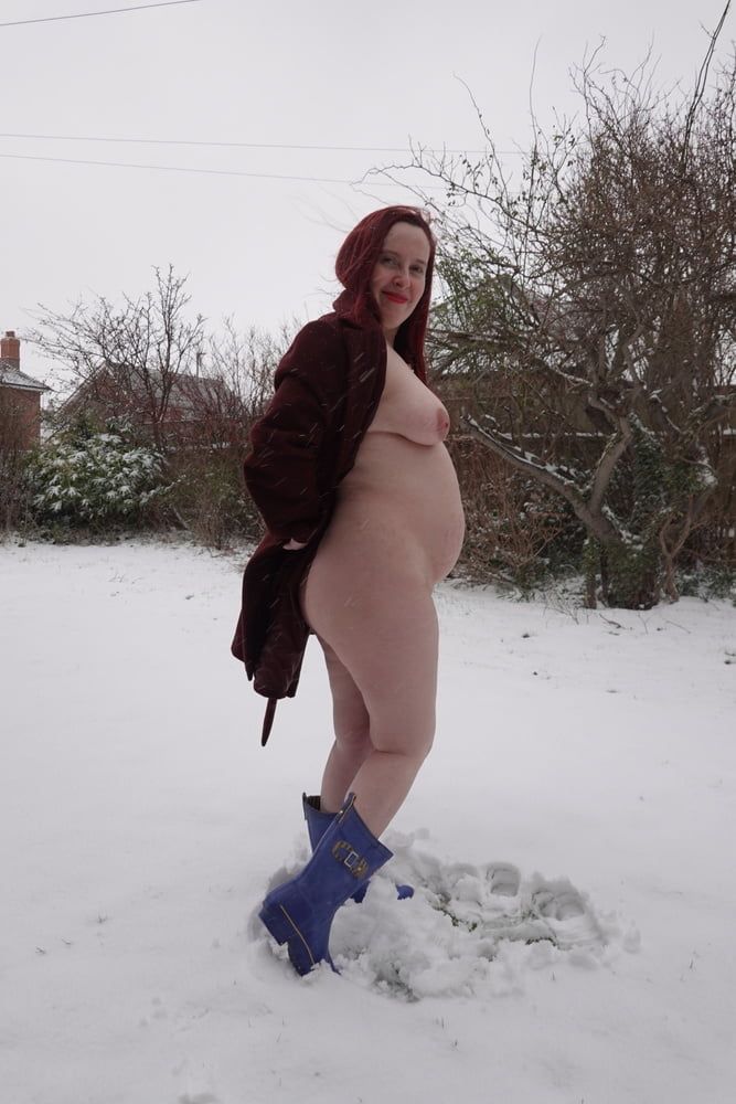 Pregnant flashing naked in the cold snow