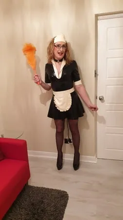 latex maid with a pump up anal plug stockings and heels         