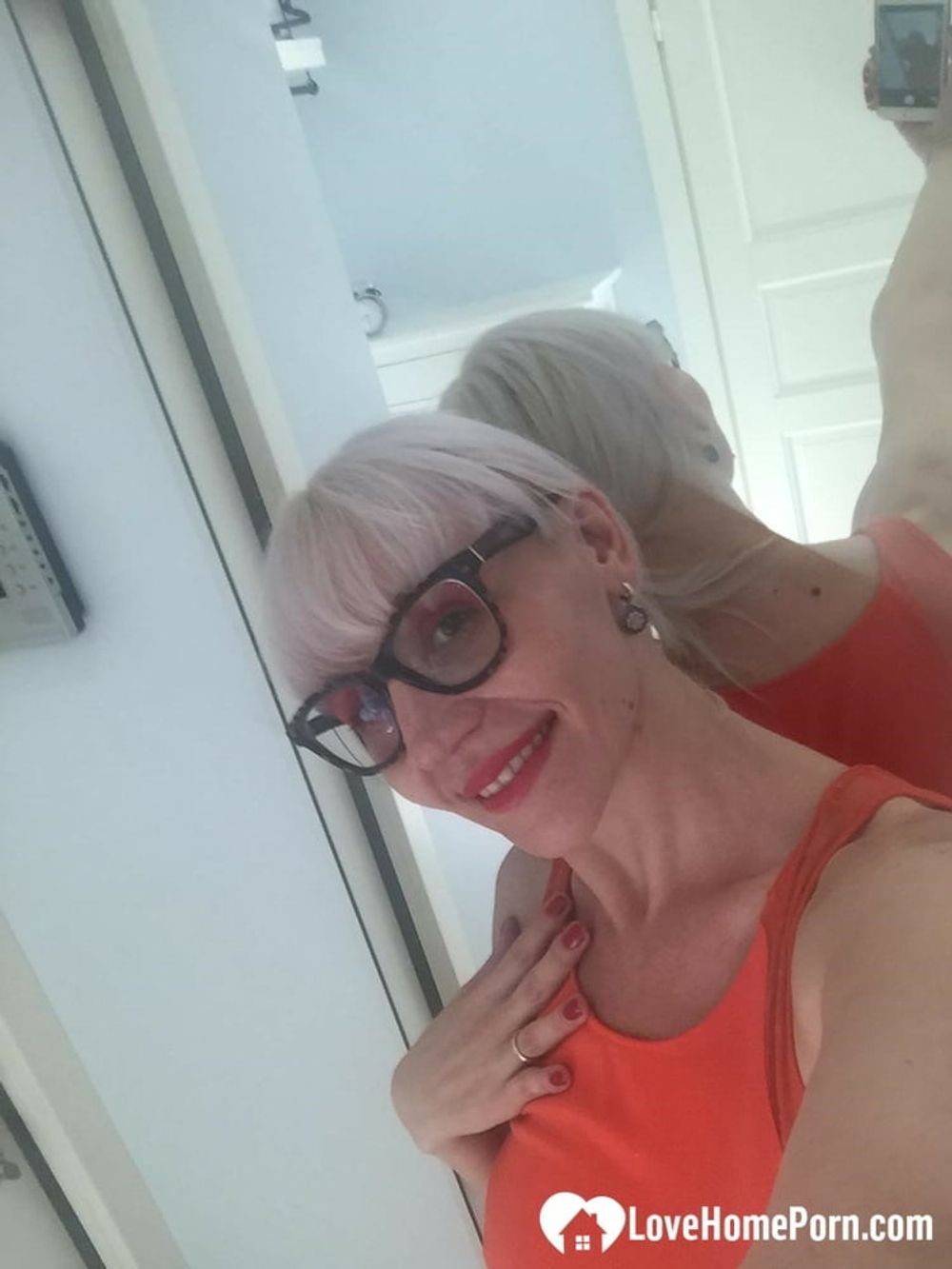 Blonde MILF with glasses teasing with nudes #6