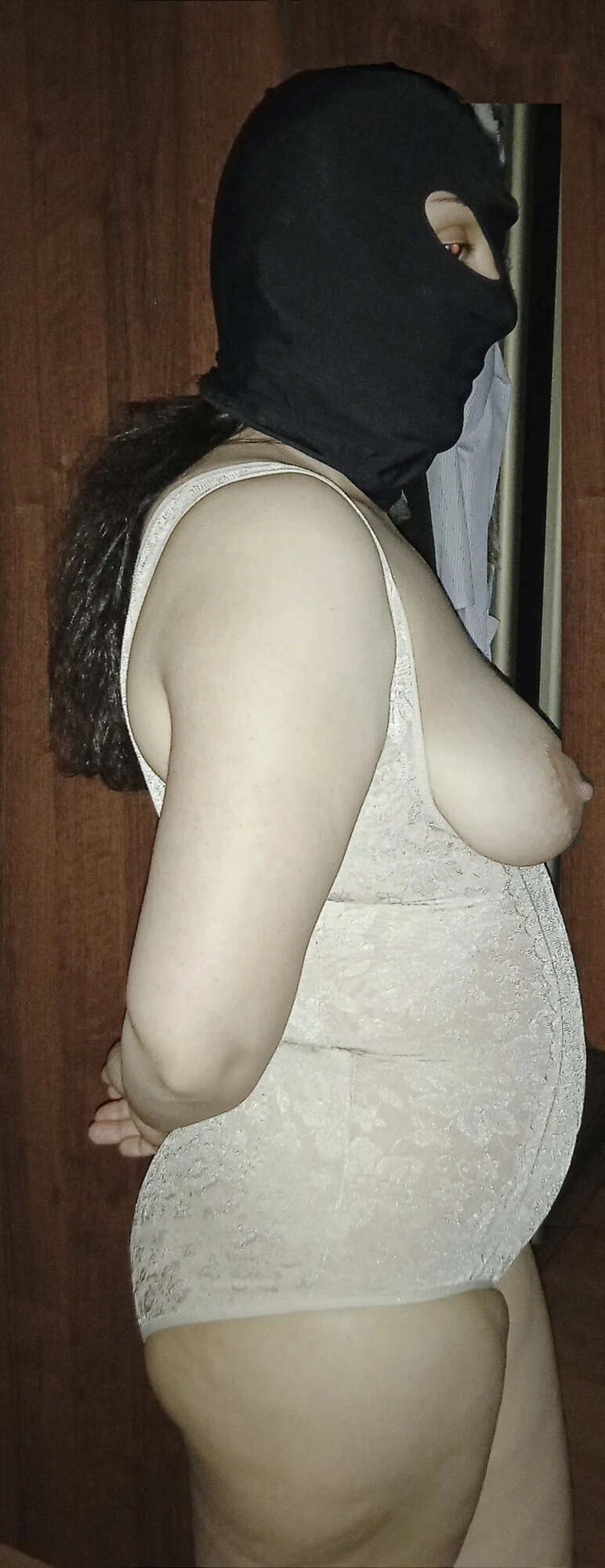 A woman in lingerie and a mask #6