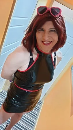 sissy lucy in black pvc and chastity cage         