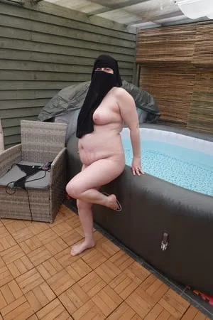 wife showing off big breasts and ass in niqab         