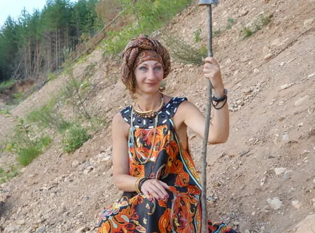 with spear wearing in colorful dress         