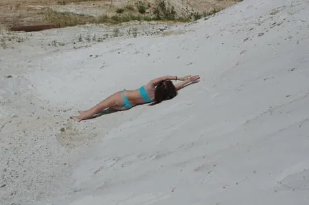 on white sand in turquos bikini         