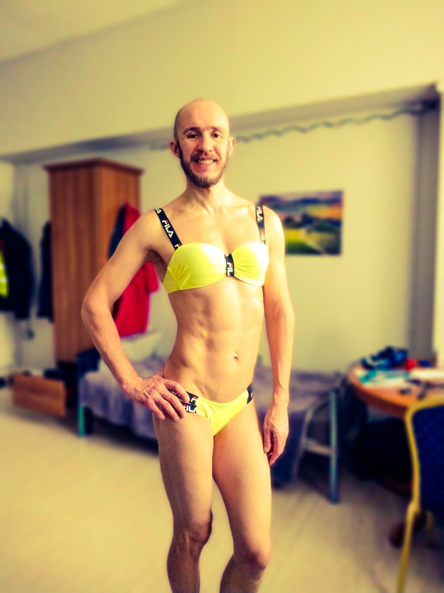 Bearded athletic man posing in yellow swimsuit  #7