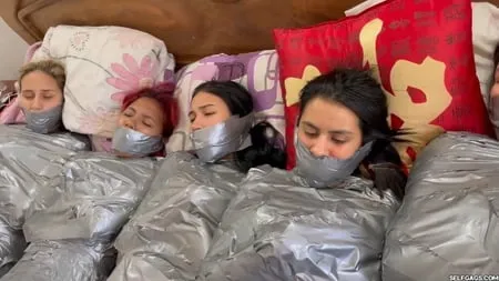   mummified girls barefoot in duct tape bondage         