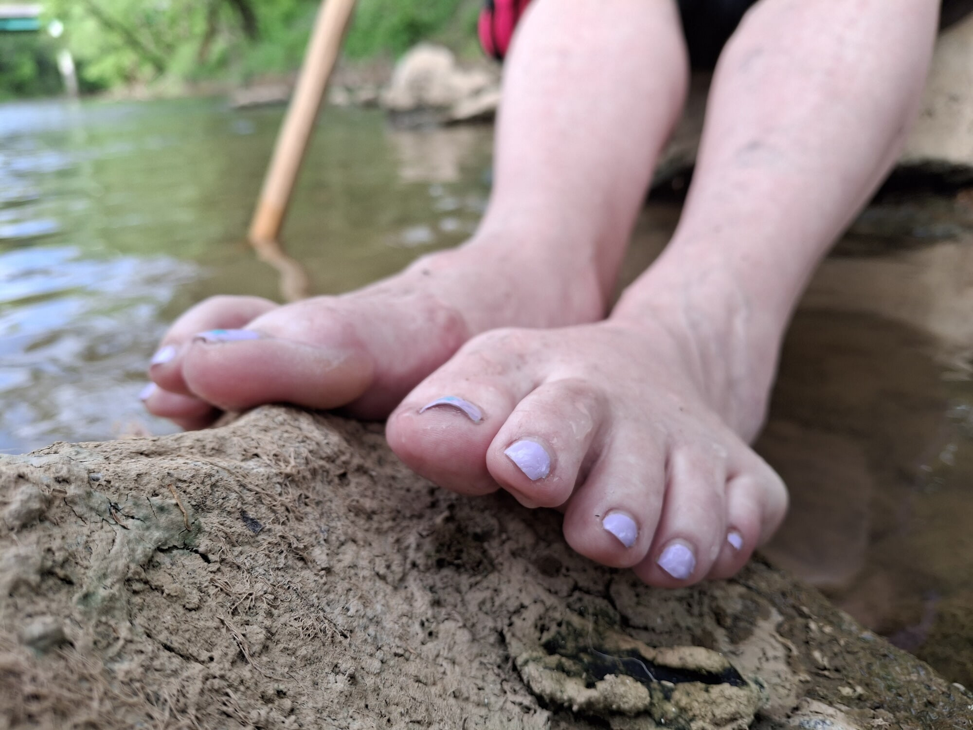Girlfriend's feet playing in the water