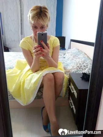 stunning milf puts on a yellow dress         