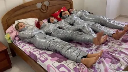   mummified girls barefoot in duct tape bondage         