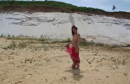 red shawl on white sand         