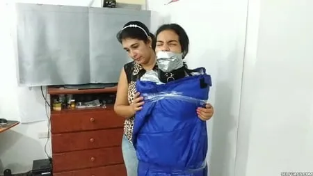 heavily duct tape mummified by crazy bondage women         