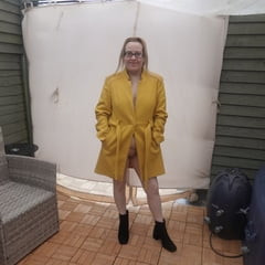 British Wife In coat out in the Yard in the cold