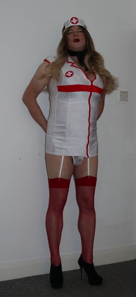 slutty looking nurse in red fishnet stockings #4