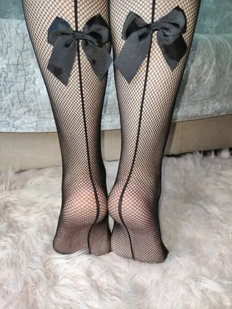 bare feet and fishnet feet heels         