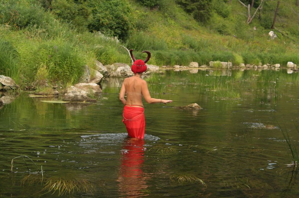 With Horns In Red Dress In Shallow River #9