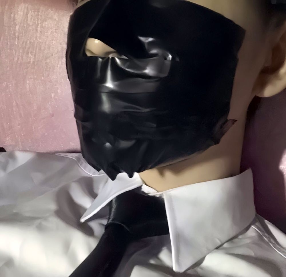 Wearing a white shirt and shiny black tie, gagged with duct  #15