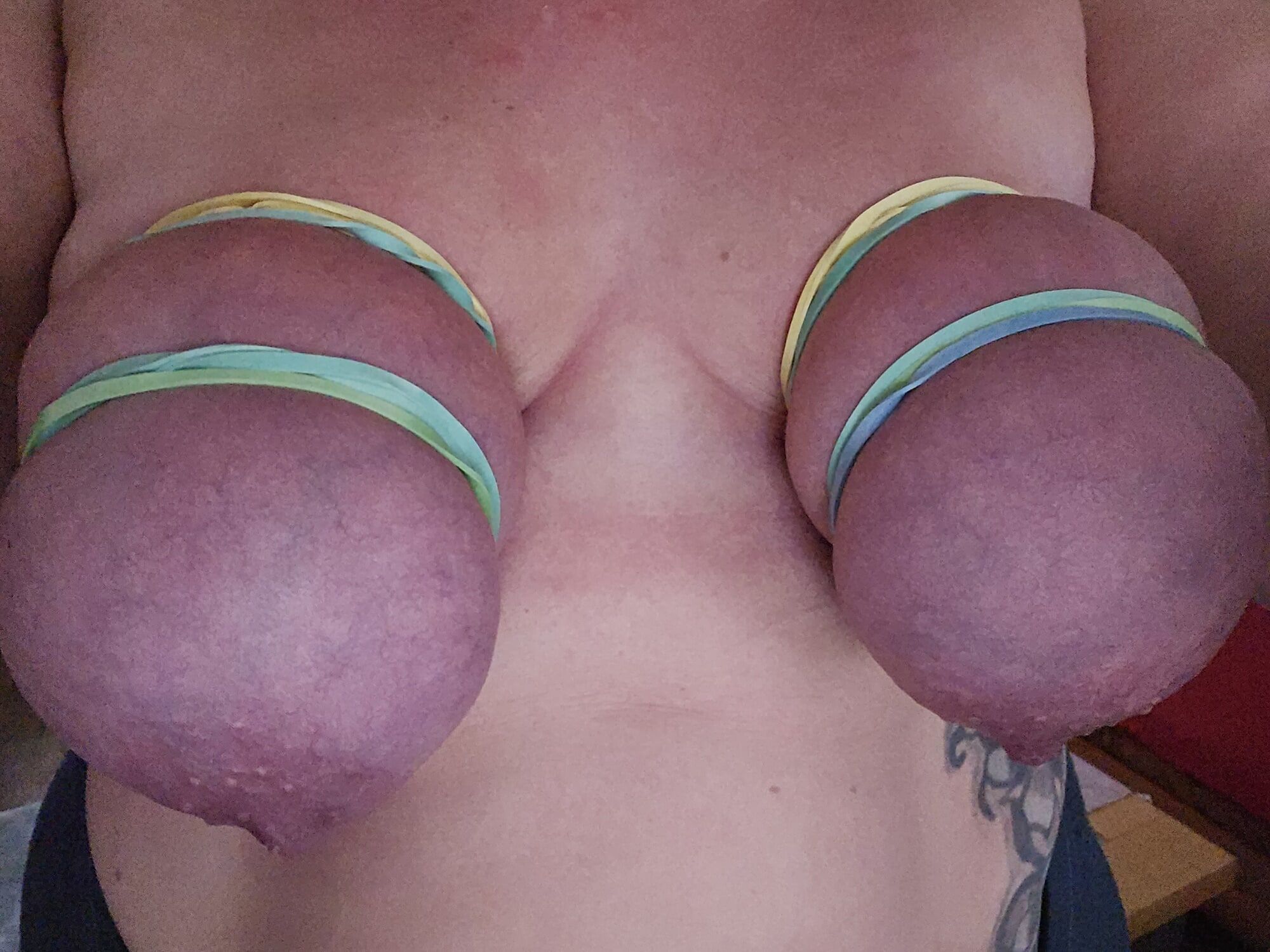 rubber bands on my tits