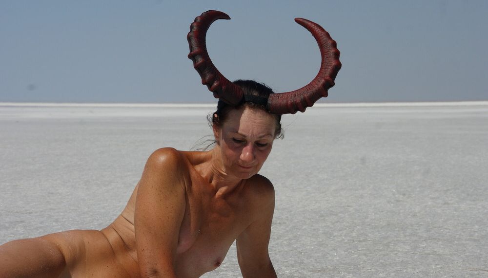 Standing on laps naked on the salt of the salt lake Elton #11