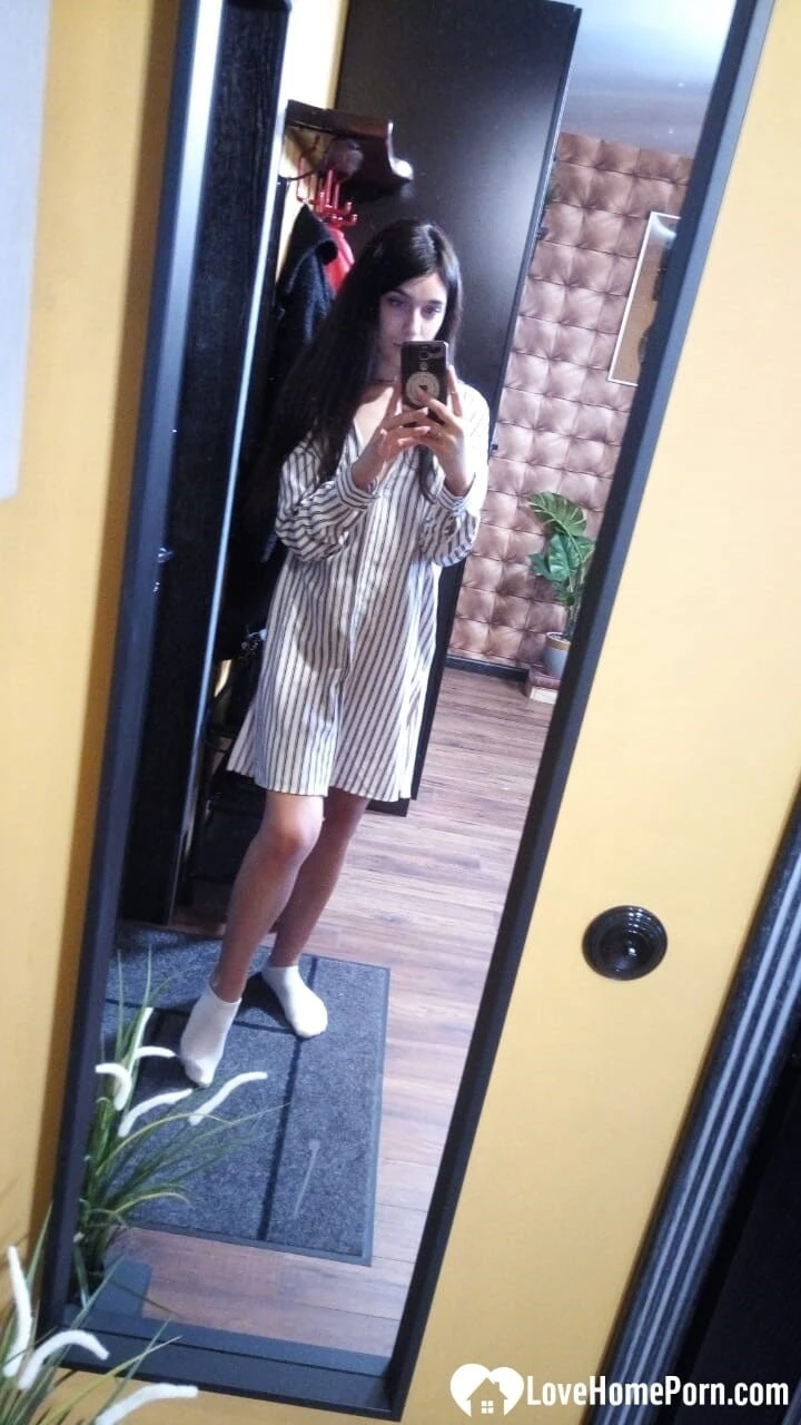 Cute long-haired brunette takes selfies in the bathroom  #6
