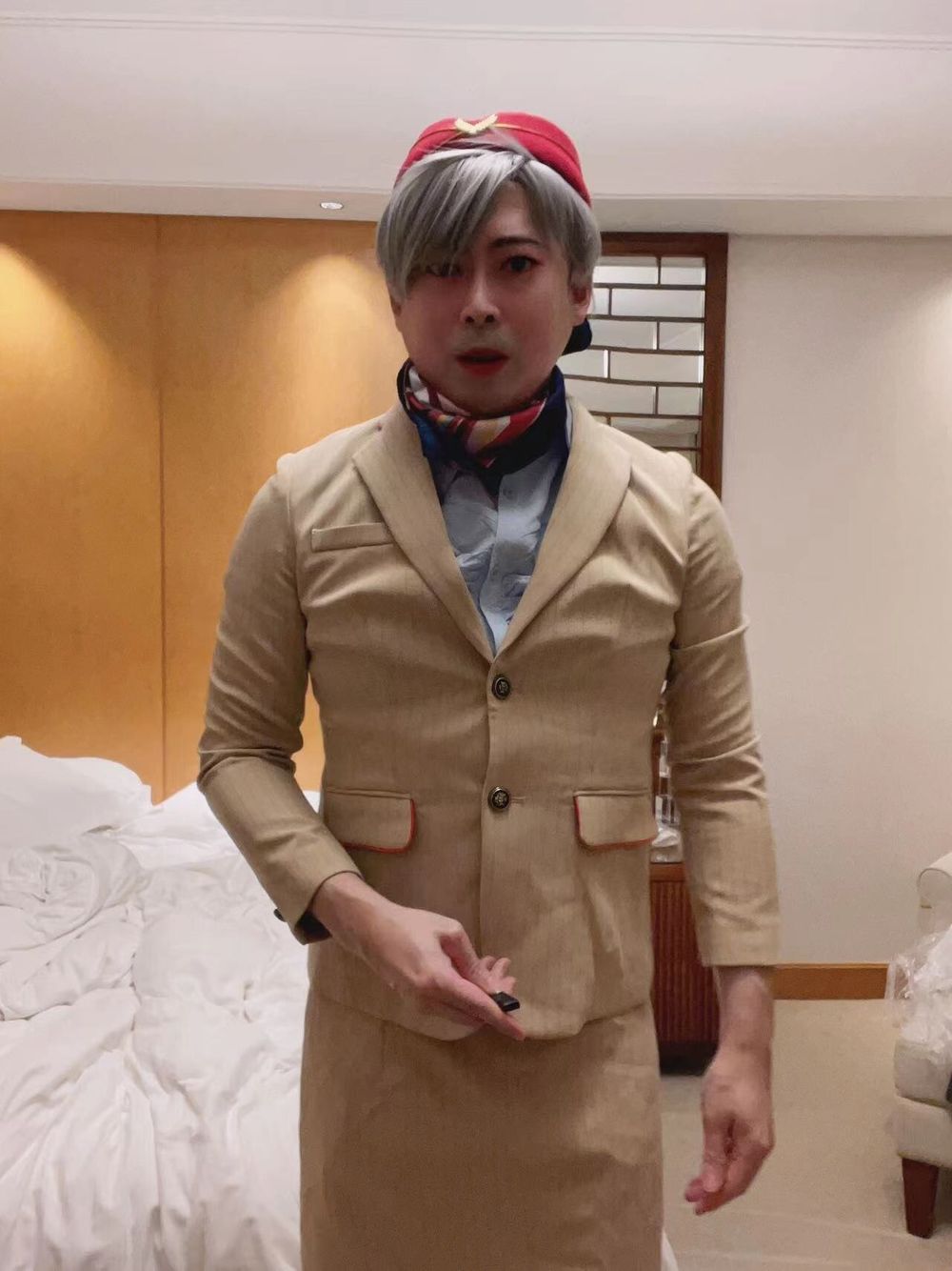 Asian femboy sissy in Emirates flight attendant dress