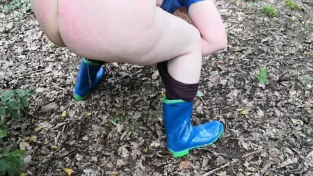 peeing in rubber boots         