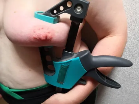 tits squeezed with clamps         