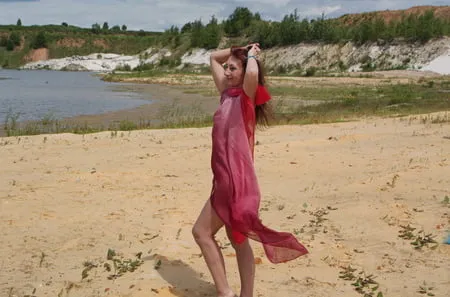 red shawl on white sand         